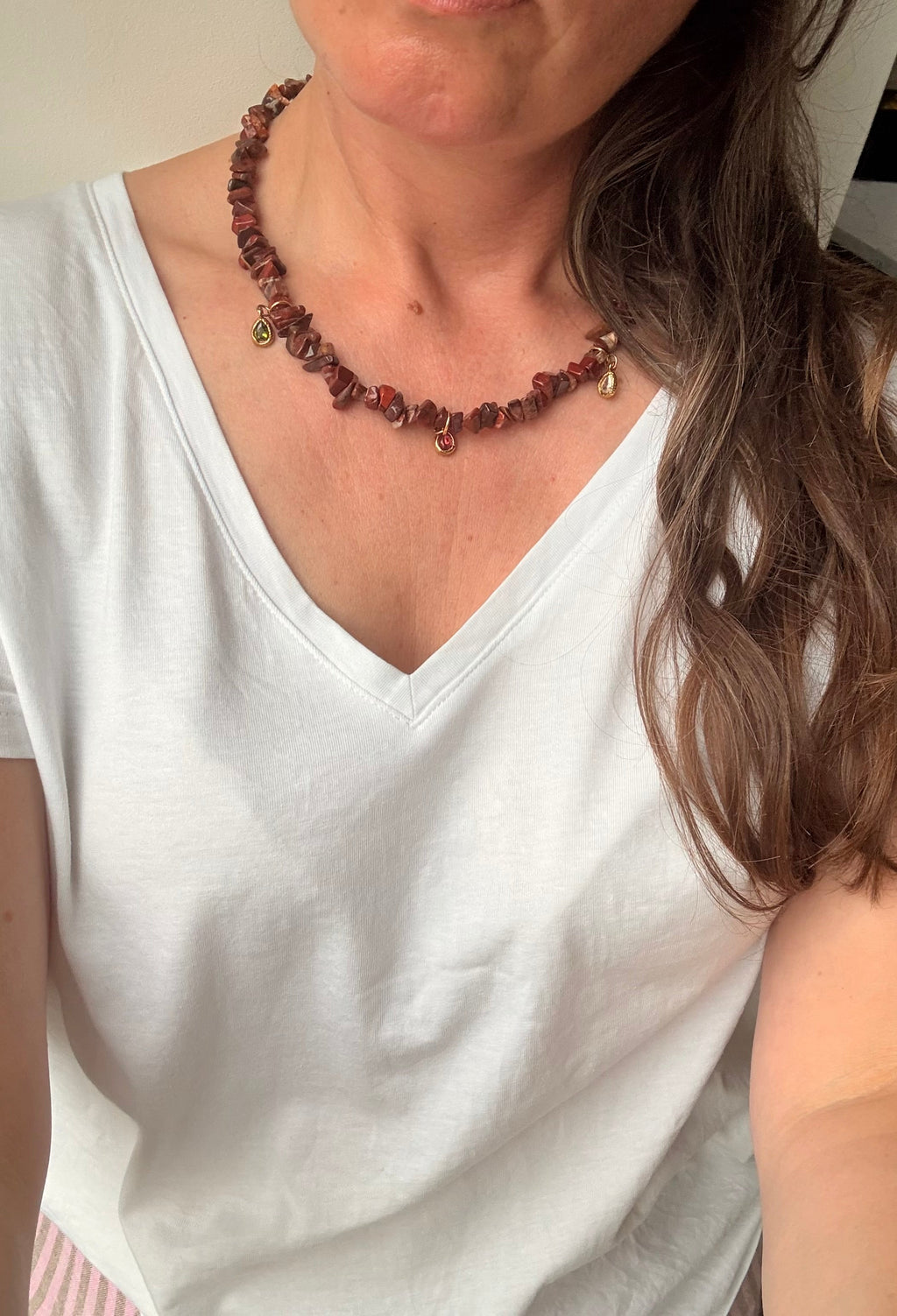 Brown jasper charm necklace worn