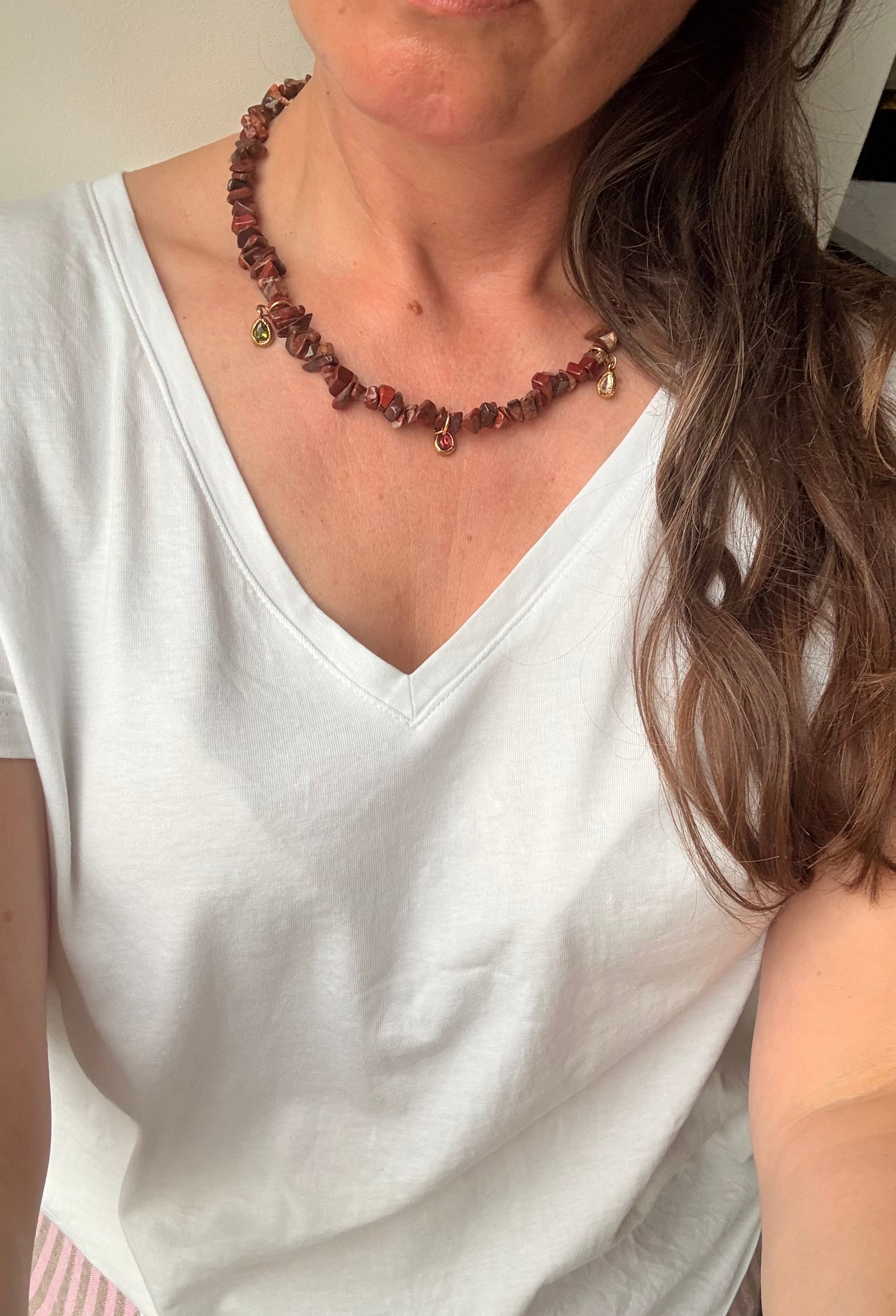 Brown jasper charm necklace worn