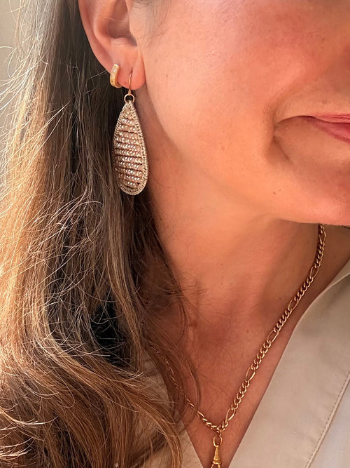 Champagne crystal teardrop earring worn - side profile