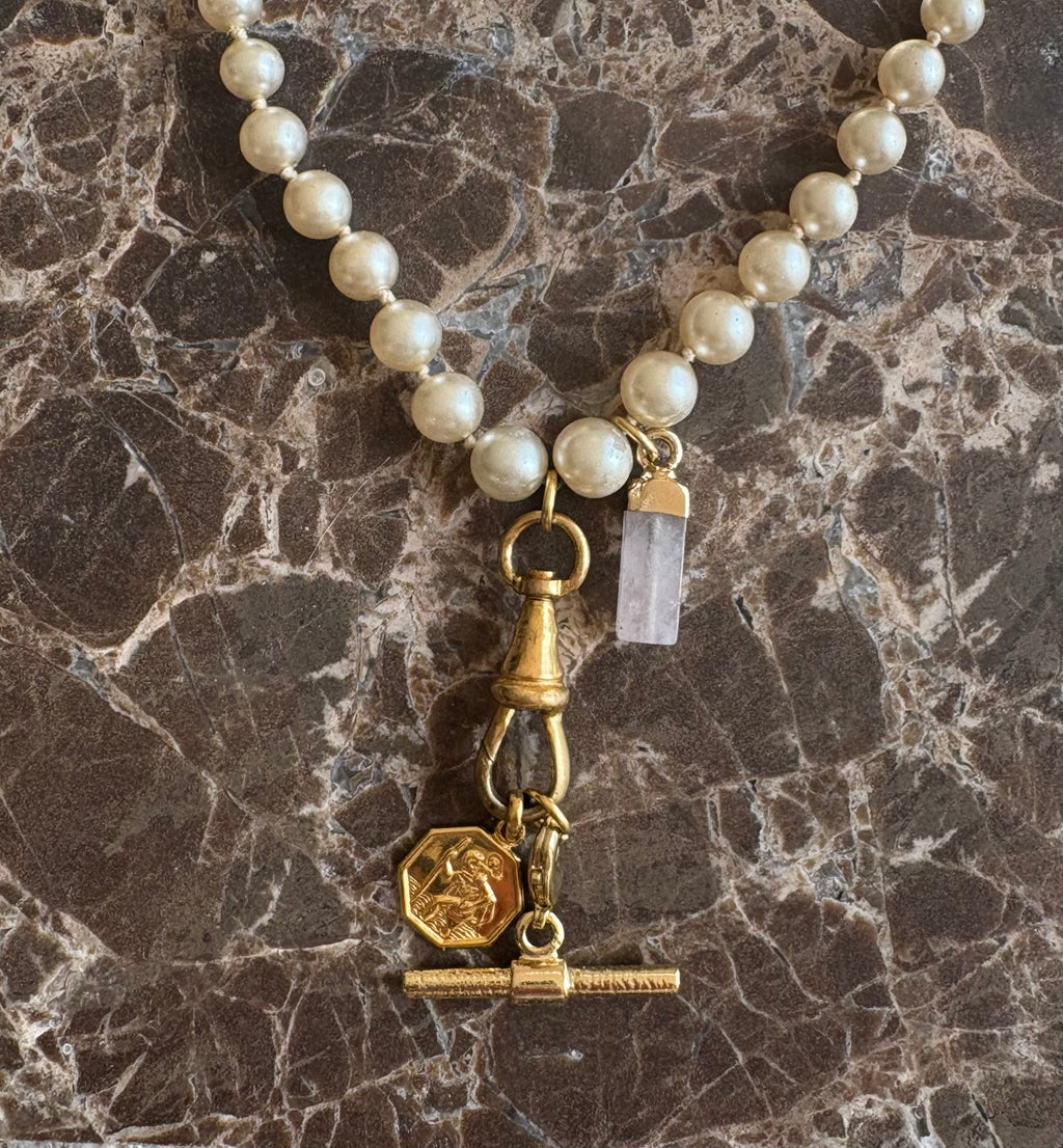 St. Christopher charm and rose quartz point detail
