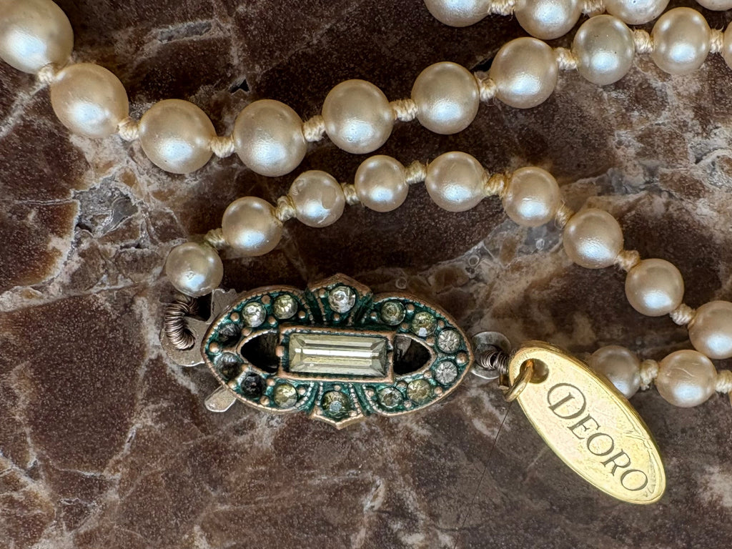 Art Deco rhinestone clasp close up with Deoro tag